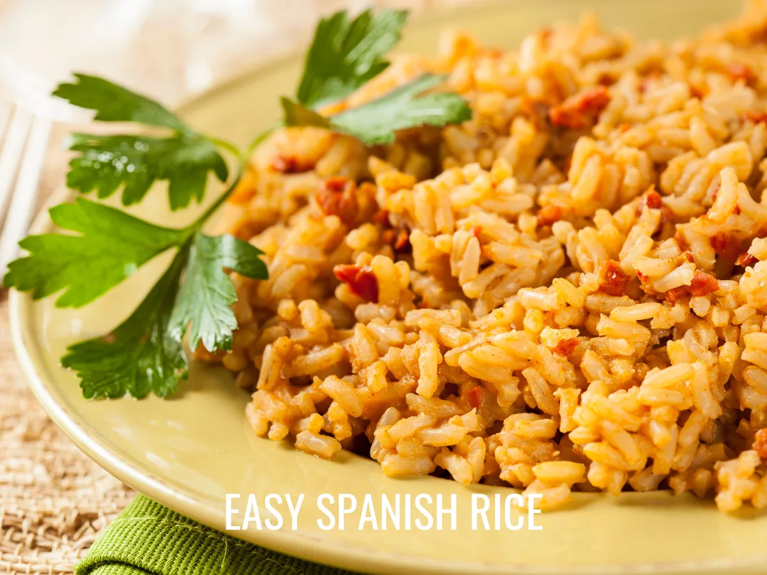 spanish rice on plate garnished with parsley