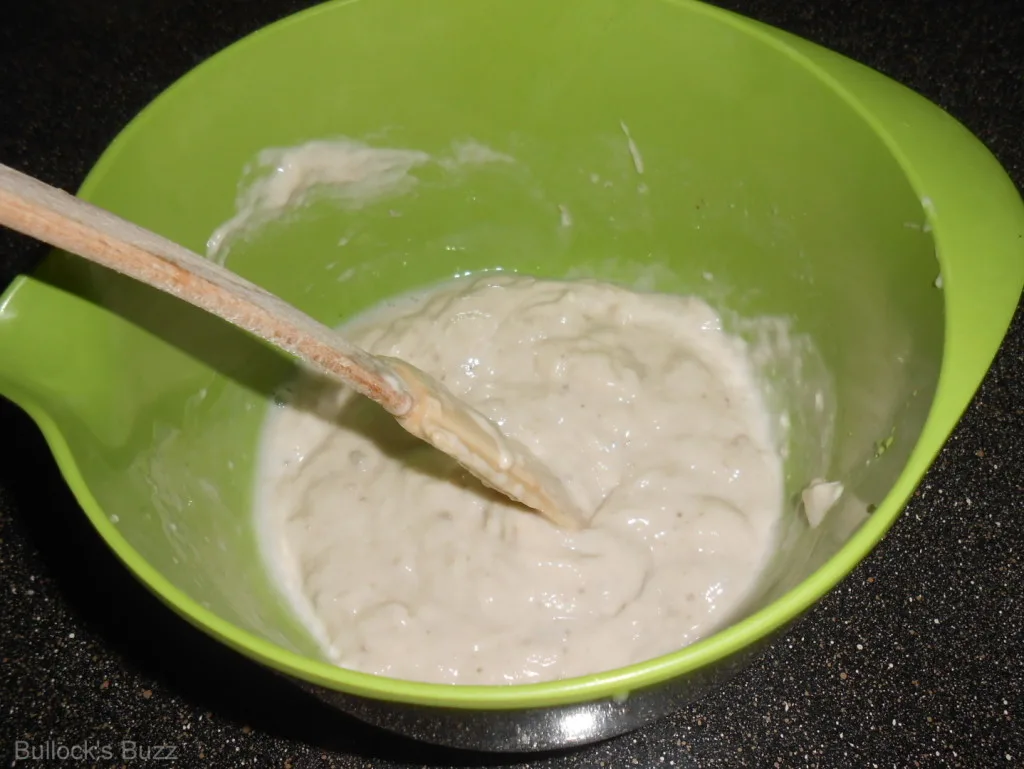 combine cream of mushroom soup and water in mixing bowl
