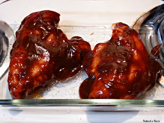 Baked BBQ Bacon Cheddar Chicken Recipe cover with bbq sauce