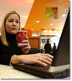 Woman at WiFi Hotspot working on Computer