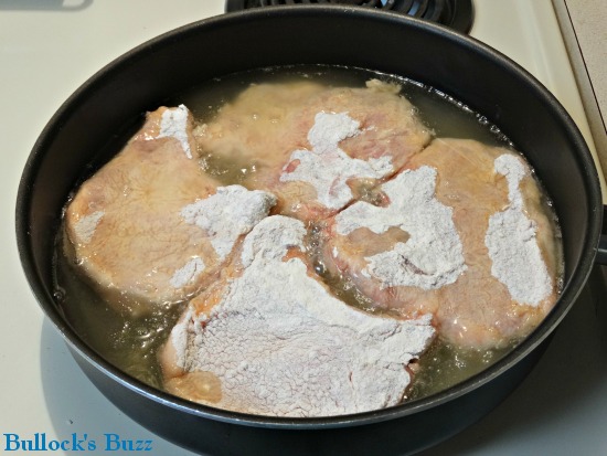 Southern-fried-pork-chops place chops in hot oil