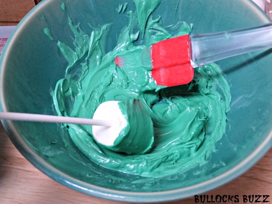 Last Minute Halloween Party Treats Frankenstein Marshmallow Pops dip marshmallow into melted candy