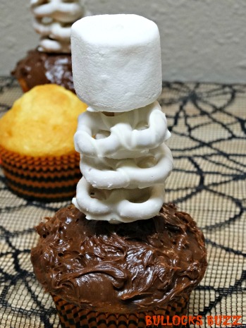 Last Minute Halloween Party Treats Scary Skeleton Cupcakes place skeleton on top of cupcake