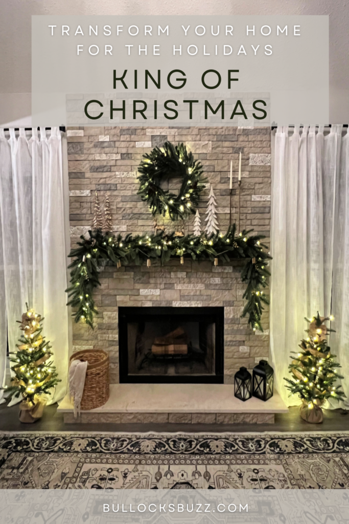 A fireplace decorated with the King of Christmas King Noble Fir 4 piece collection lit up 