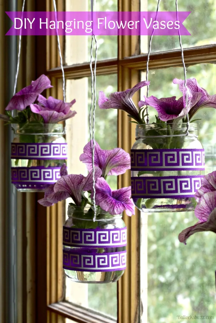 Spring Ideas. Made from upcycled baby food jars, these simple DIY Hanging Flower Vases look great hanging in your windows!