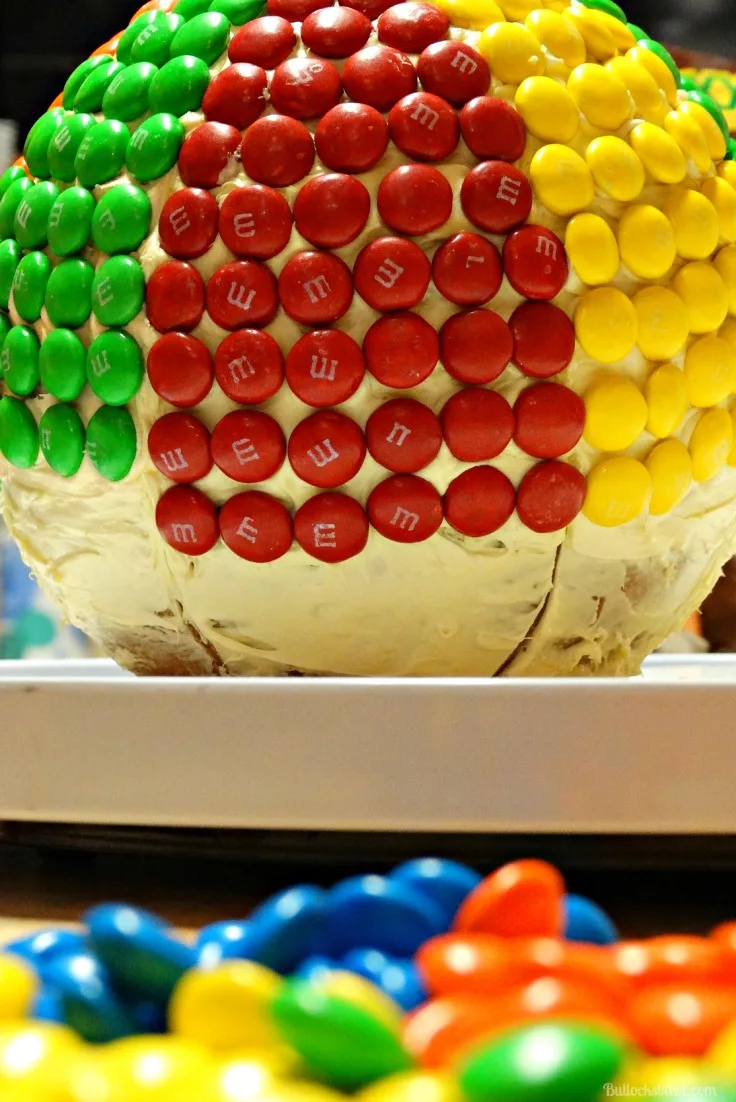 M&M Beach Ball Cake adding M&Ms on row at a time