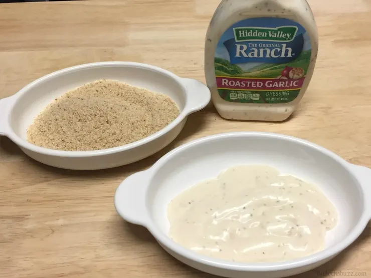 Roasted Garlic Ranch and Shredded Parmesan Baked Chicken put bread crumbs in one bowl ranch in another