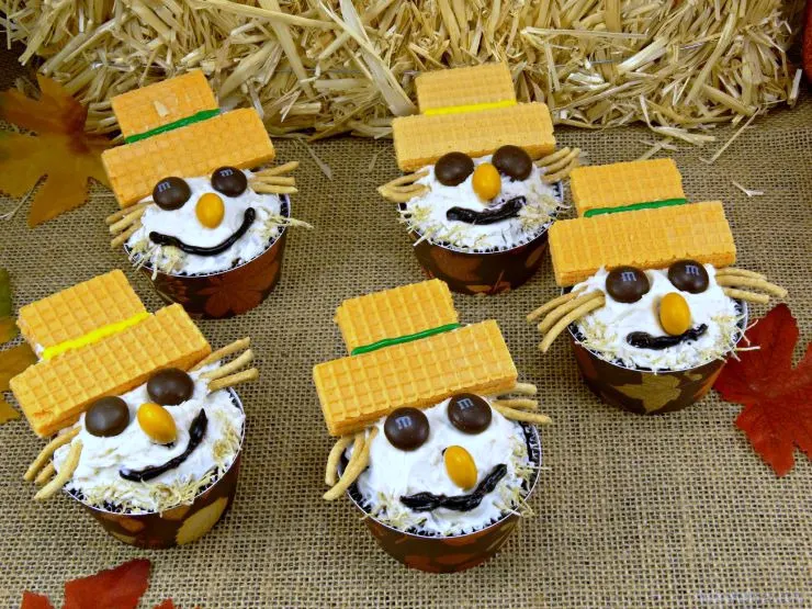 Cute Fall Scarecrow Carrot Cake Cupcakes with M&M eyes and cookie hats.