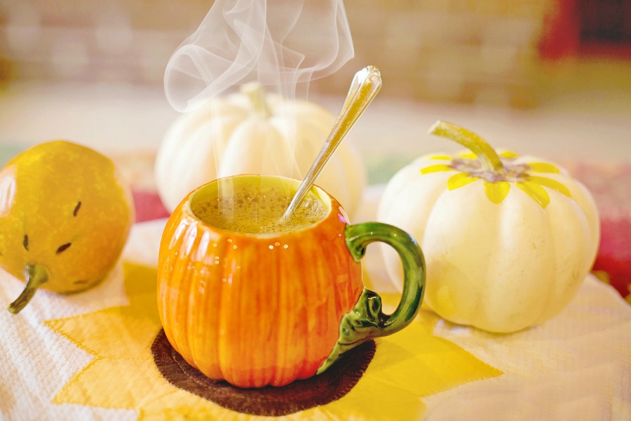 pumpkin spice latte in a pumpkin cup 