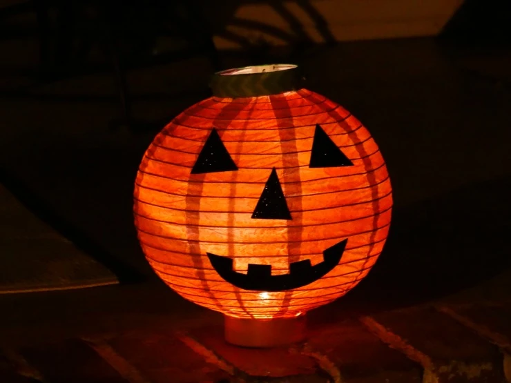 One of the DIY Halloween Lantern Pumpkins lit up