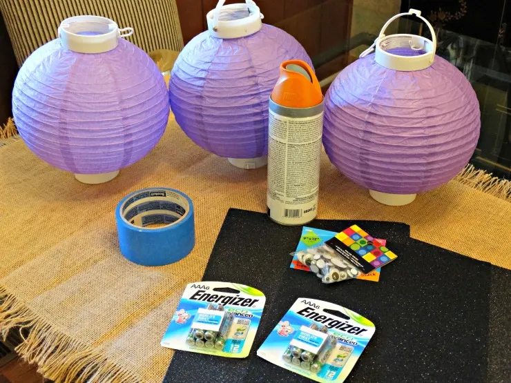 Supplies to make DIY Halloween Pumpkin Lanterns laid out on a table