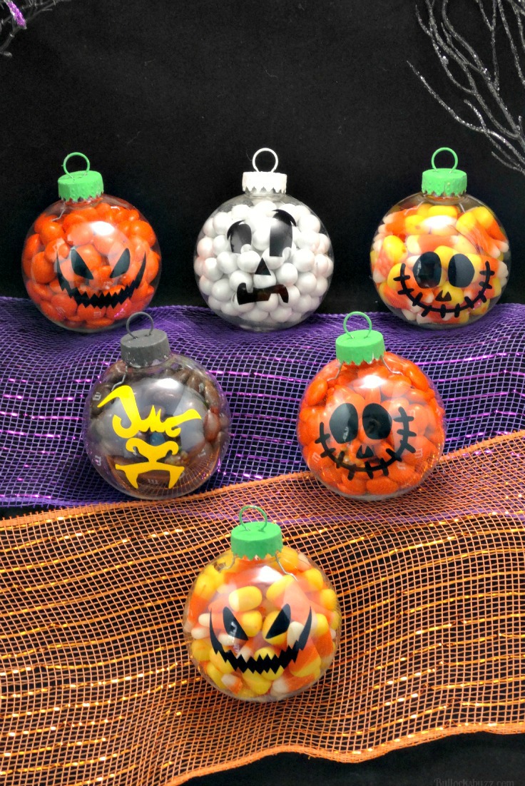 A group of finished DIY Halloween candy ornaments including pumpkins, ghosts and werewolves.