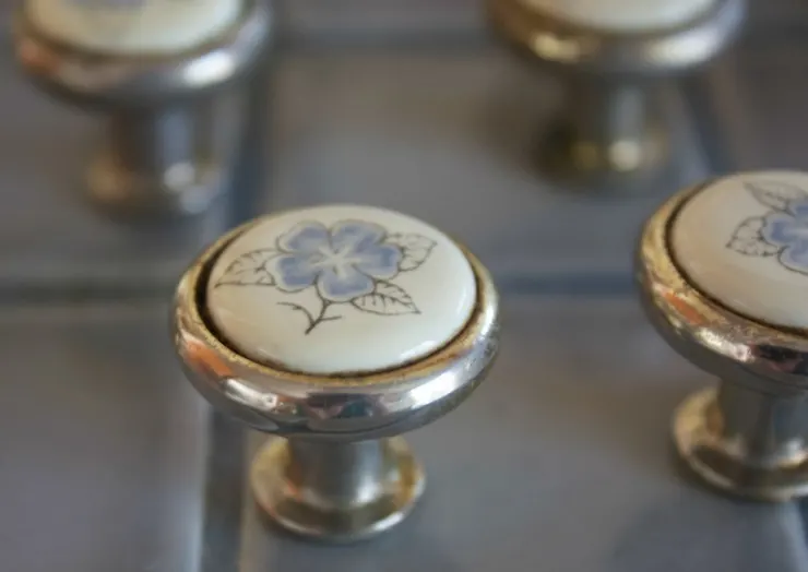 changing cabinet knobs is one way to decorate your apartment without losing your deposit