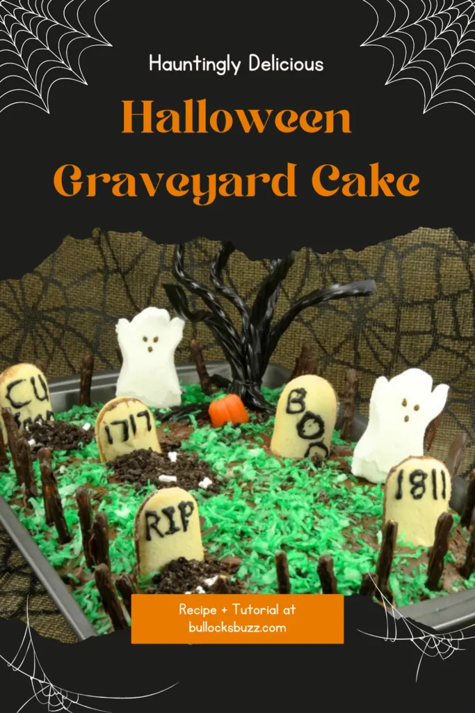 A chocolate cake decorated to look like a haunted graveyard with tombstones, ghosts and an old rickety fence.