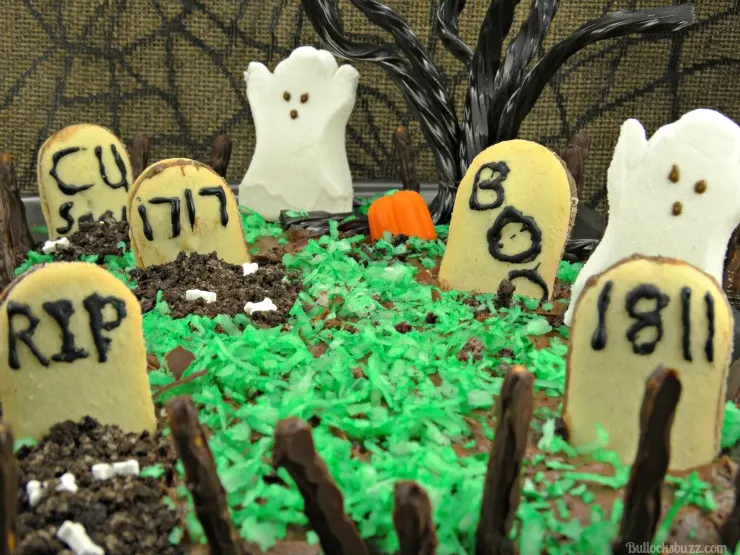 haunted graveyard fanta orange cake with oreo fence close up