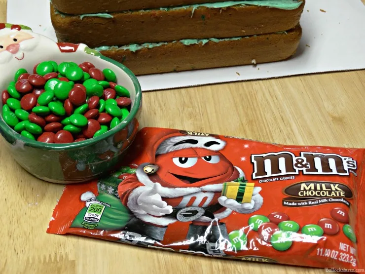 holiday M&MS in bowl with package in front of surprise inside cake layers