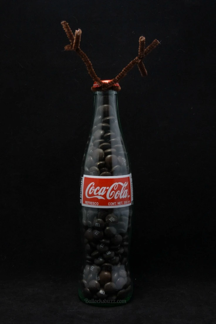 fill bottle wth candies to start the Reindeer DIY Coke Bottle Characters 