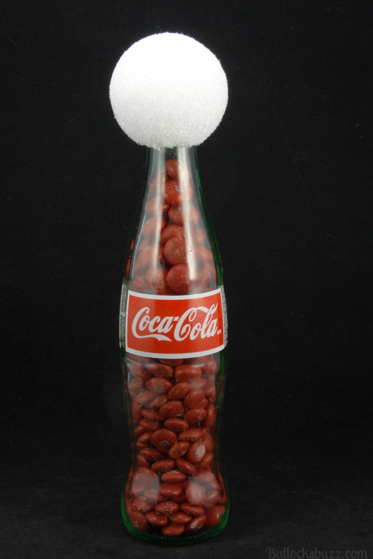 fill bottle with candy and attach head to start your Santa DIY Coke Bottle Characters 