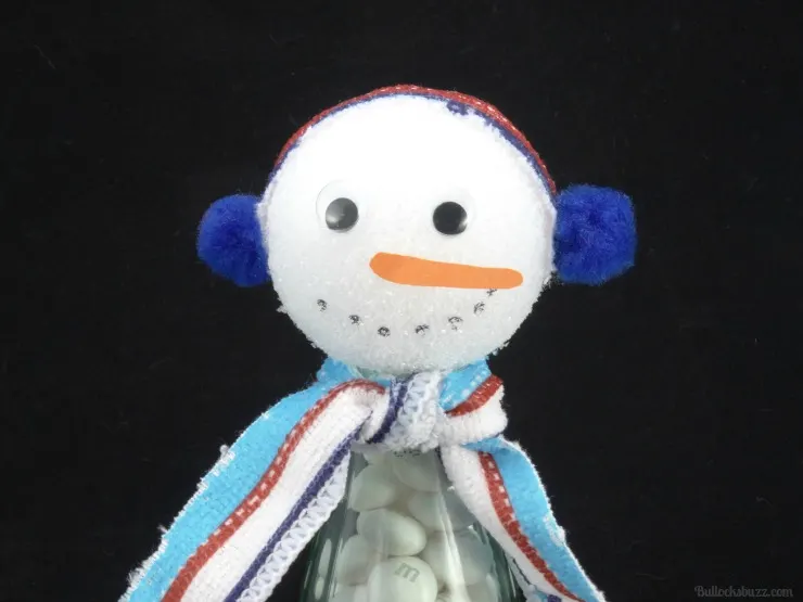  holiday craft snowman bottle glue on earmuffs, add facial features