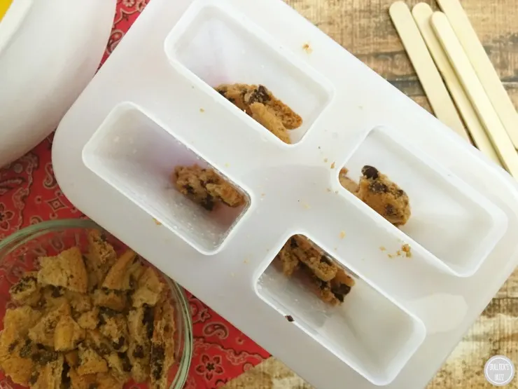 French Vanilla Pudding Pops add some of the crumbled cookies into the bottom of molds