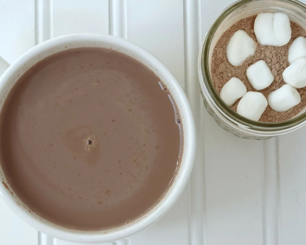 homemade hot chocolate mix in jar with mug of hot chocolate