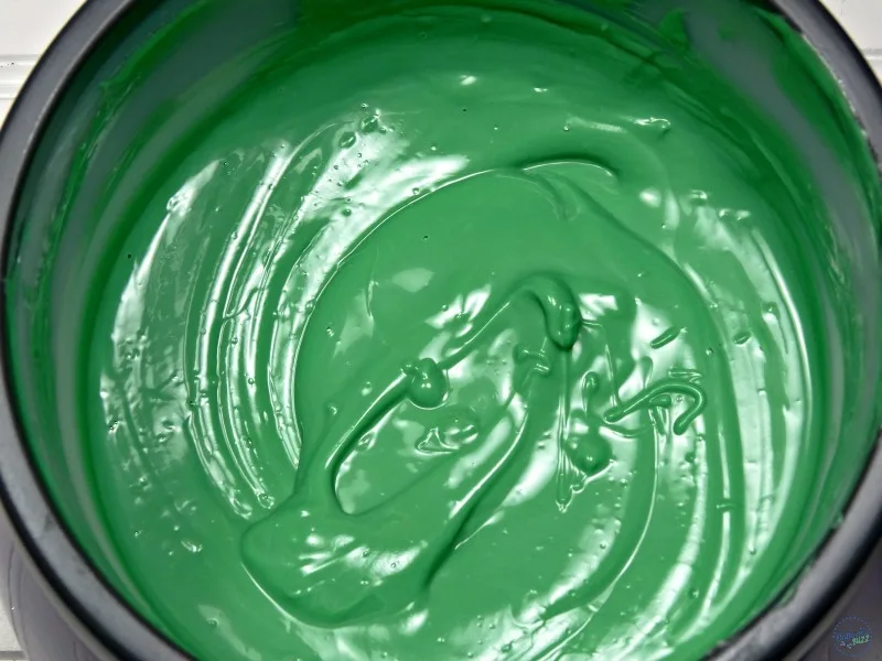 Green candy melts in a large bowl for dipping twinkies