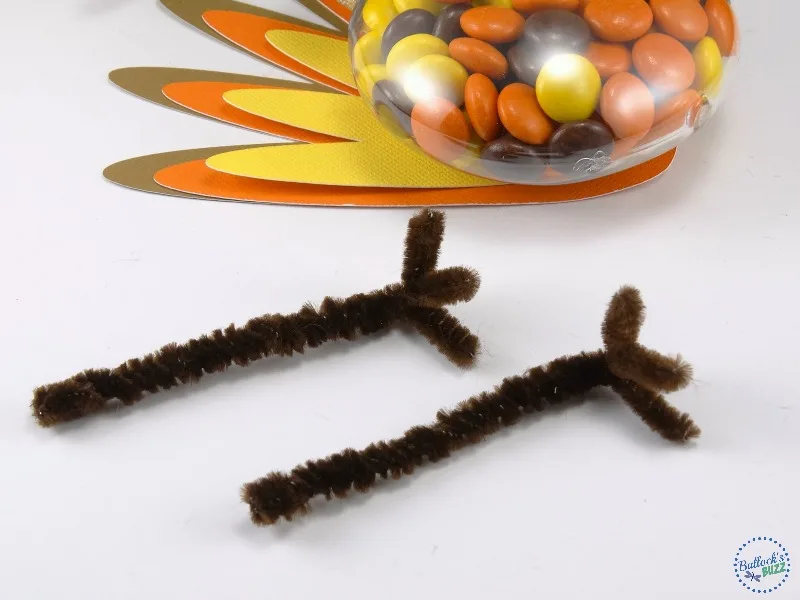 make Thanksgiving Turkey Treats legs by twisting pipe cleaners together