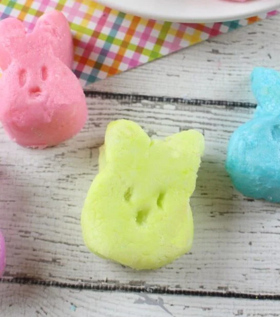close up of four pastel-colored Cream Cheese Mints for Easter shaped like bunnies