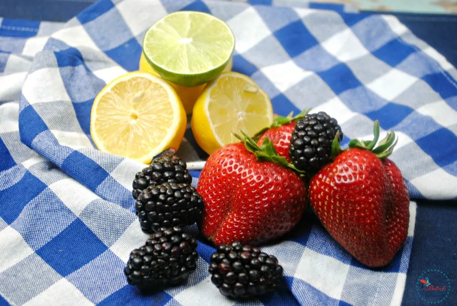 fresh fruits on blue and white tablecloth