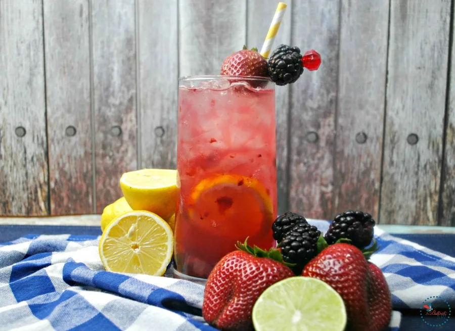 Berry Smash Lemonade in glass on a checkered tablecloth
