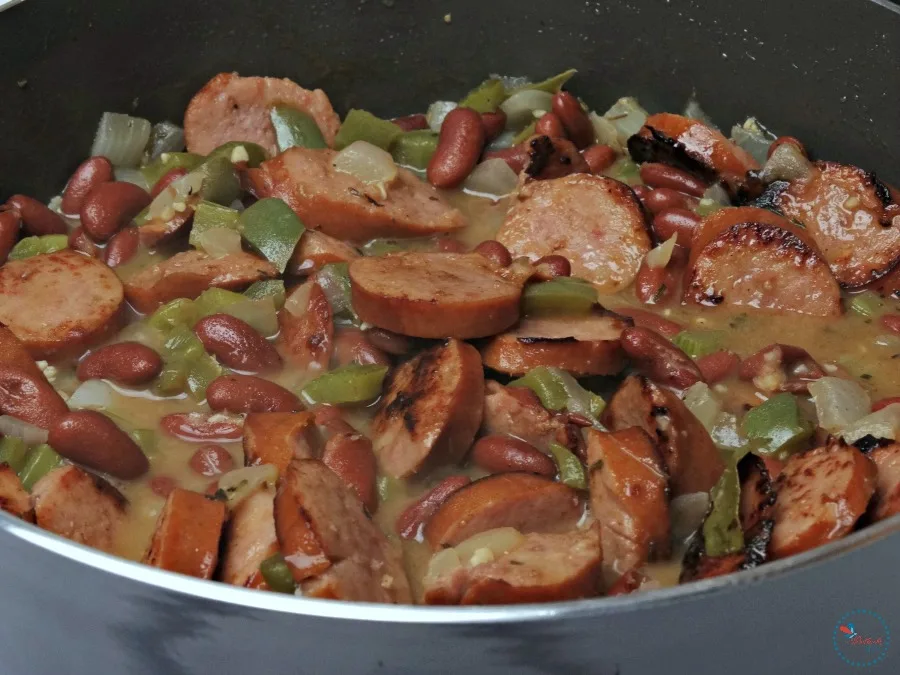  combine veggies, beans and sausage in large pan and cook