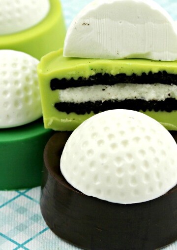 Golf Ball Cookies stacked with a cut-open Oreo cookie showing the chocolate layers and white golf ball topping