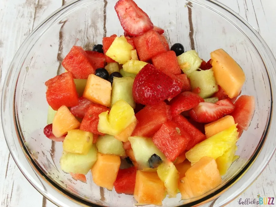 Pineapple Boat Fruit Salad toss to mix