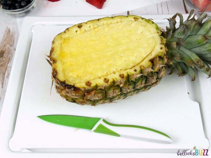 Pineapple Boat Fruit Salad cut along the inside perimeter