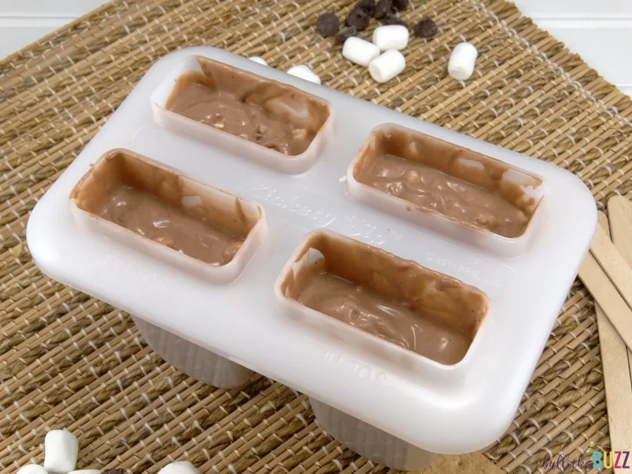 S'mores Pudding Pops fill molds three quarters full with mixture