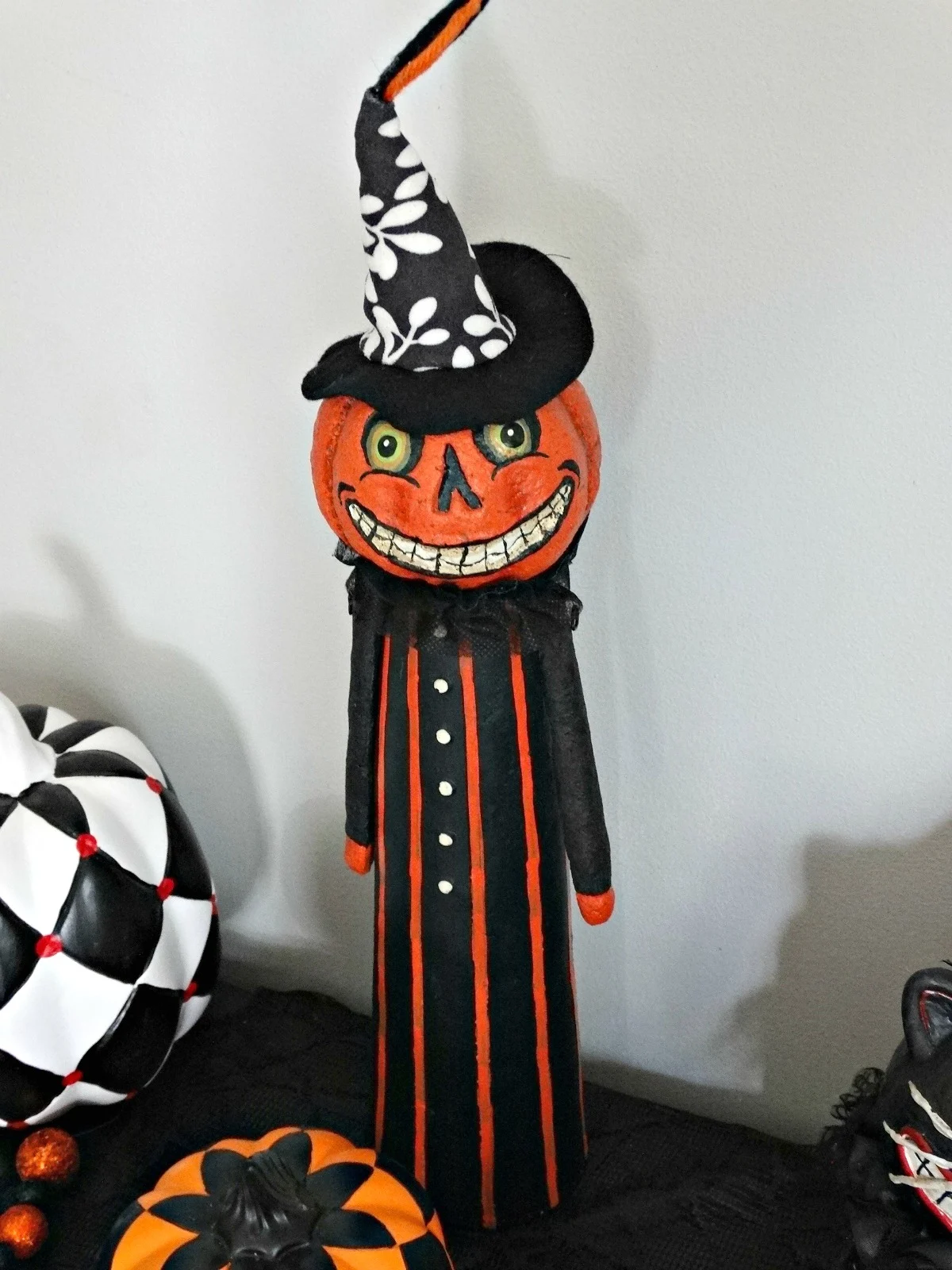 Haunted Harlequin pumpkin man figurine