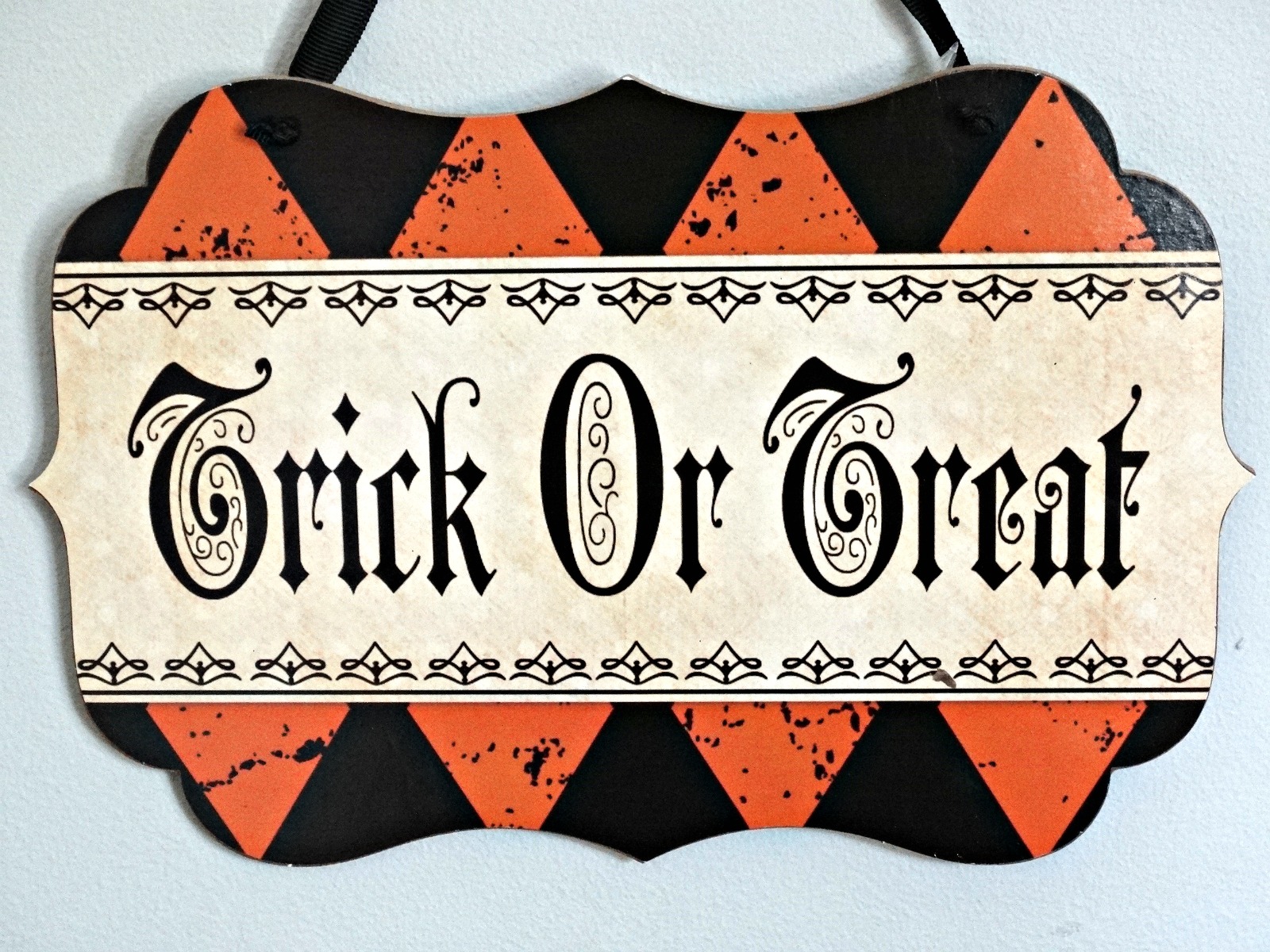 Halloween tablescape Haunted Harlequin trick or treat sign