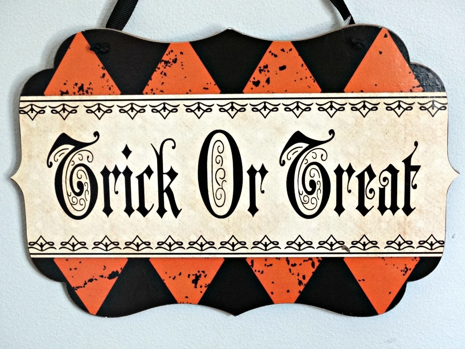 Halloween tablescape Haunted Harlequin trick or treat sign