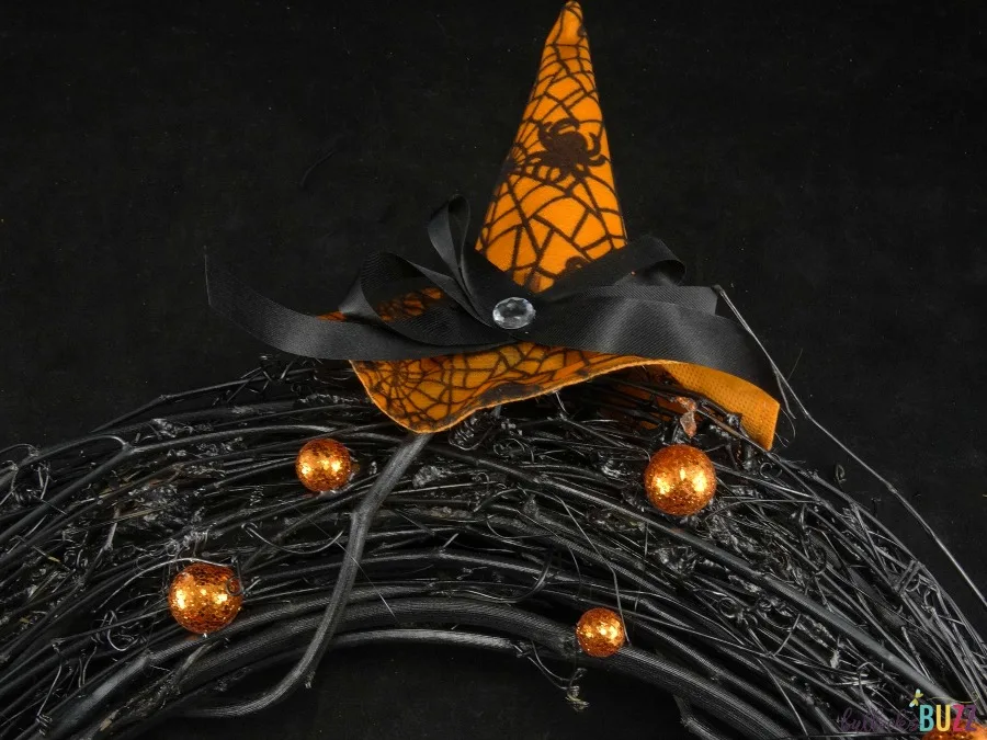 Homemade Halloween Wreath tutorial glue witch hat to top right side of wreath
