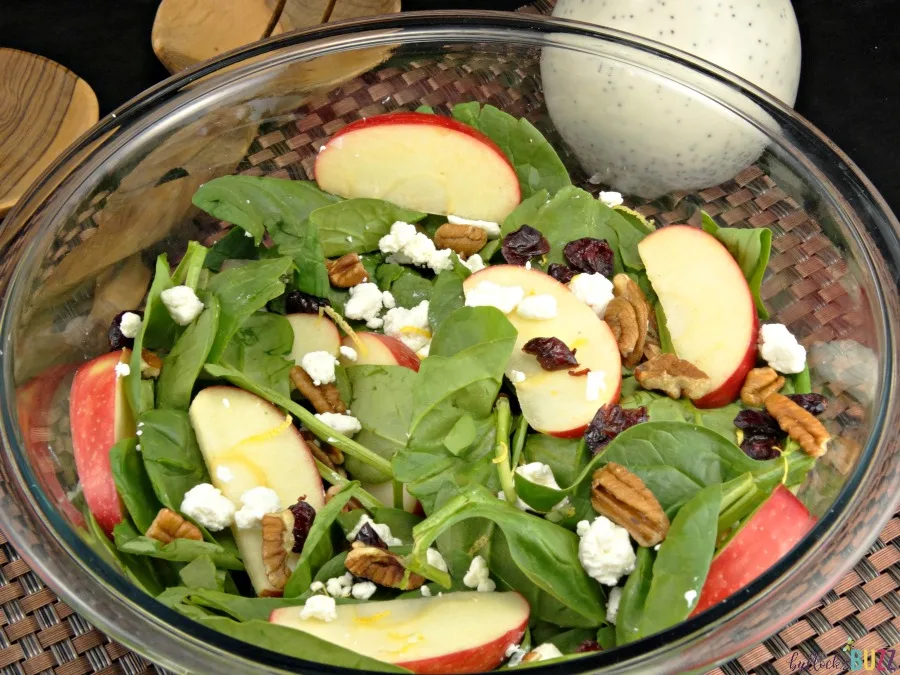 overhead shot of salad with apples, cranberries, walnuts and goat cheese