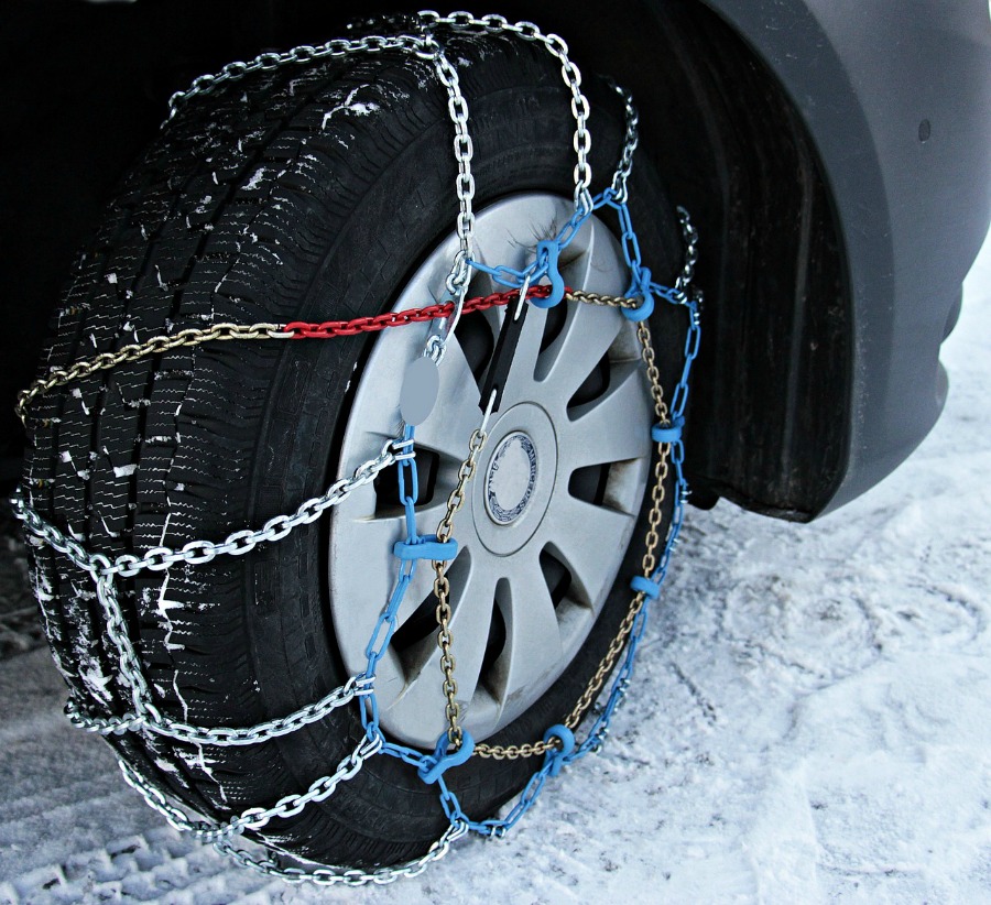 Winterizing Your Car - 5 Simple Ways to Prepare Your Car For Rain or Snow adding snow-chains