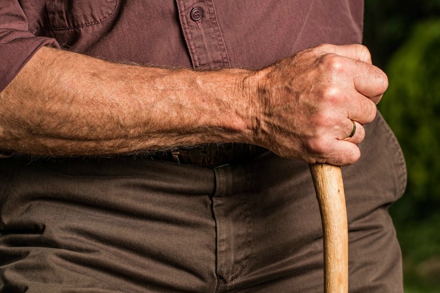 preventing falls in the elderly - man using a cane