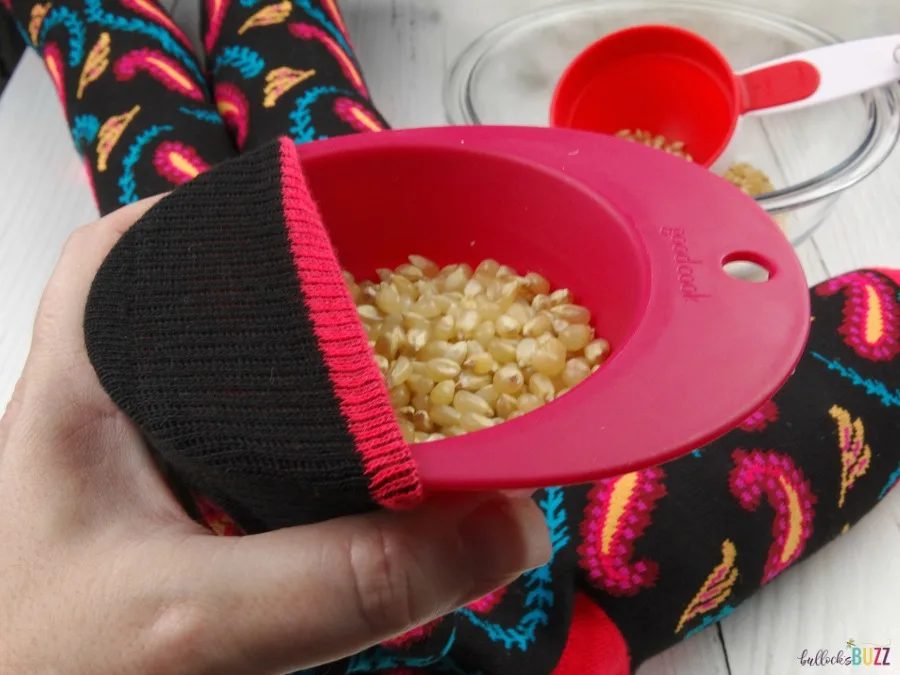 DIY Draft stopper add popcorn kernels to sock alternating with stuffer