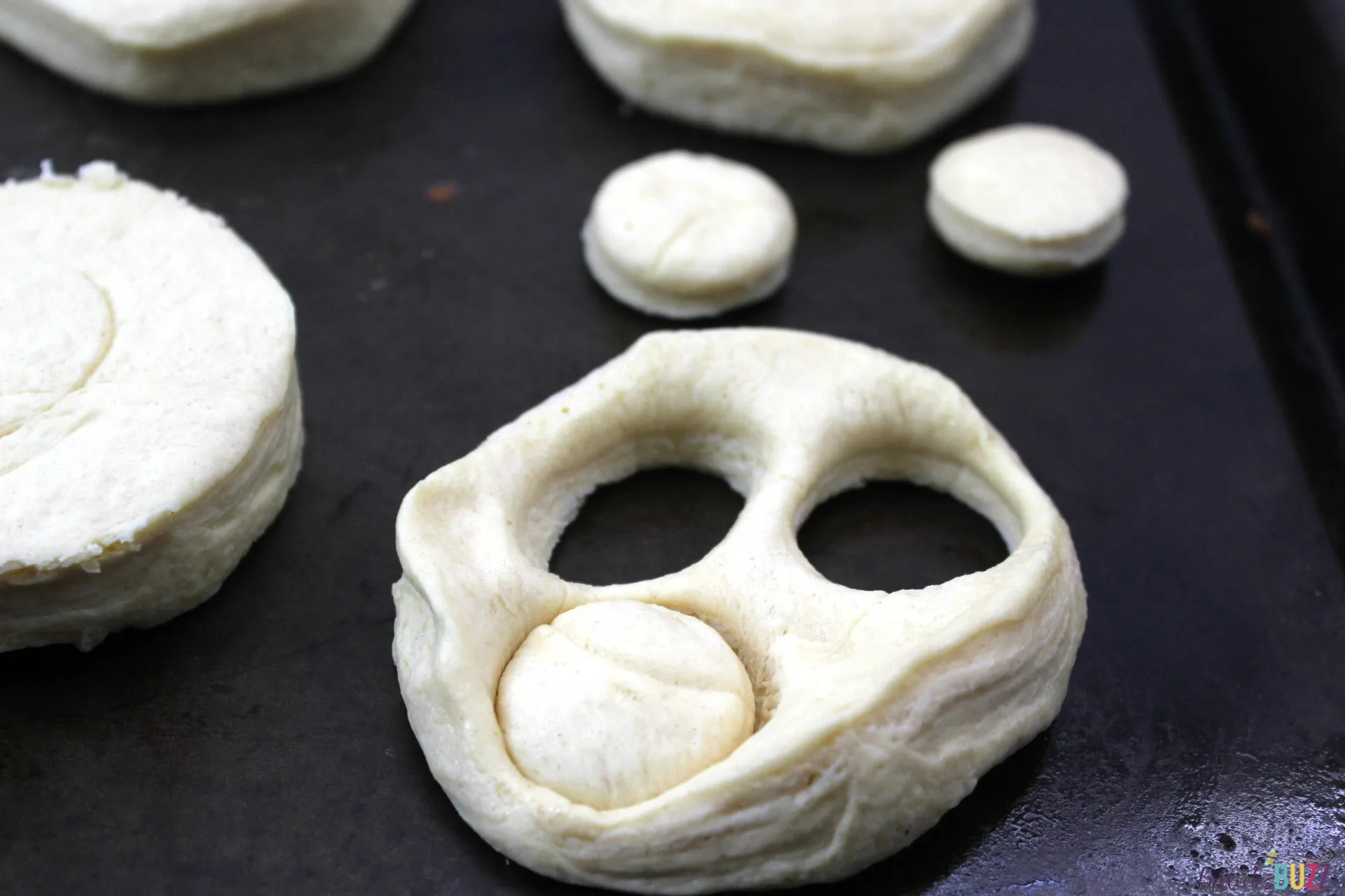 use a 1 inch cookie cutter or bottle cap to punch holes in dough