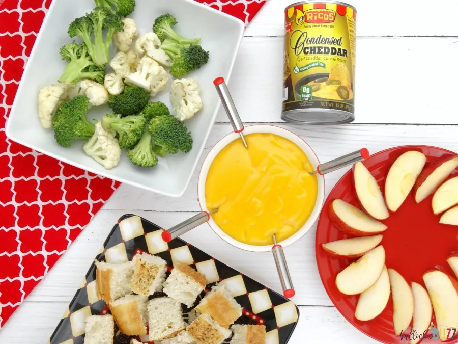 Cheddar Cheese Fondue served with apples, veggies and bread