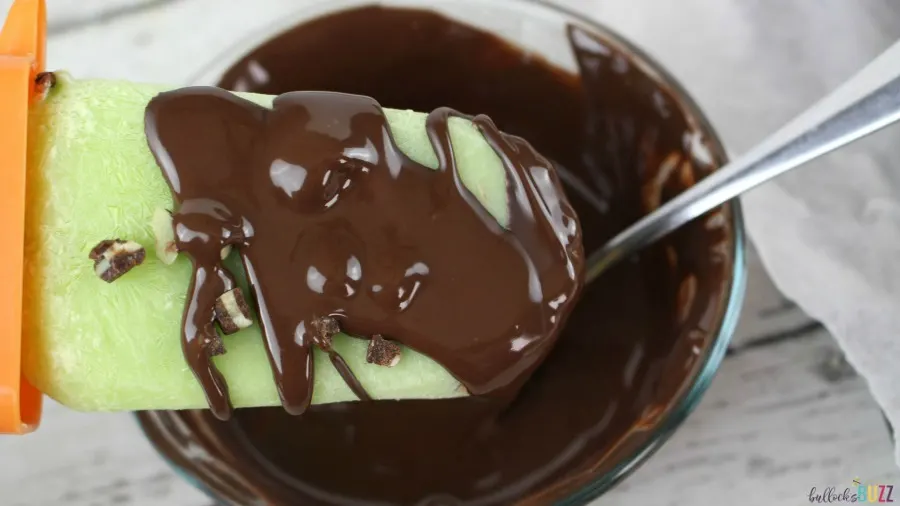 remove from mold drizzle Andes Chocolate Mint Popsicles with melted chocolate