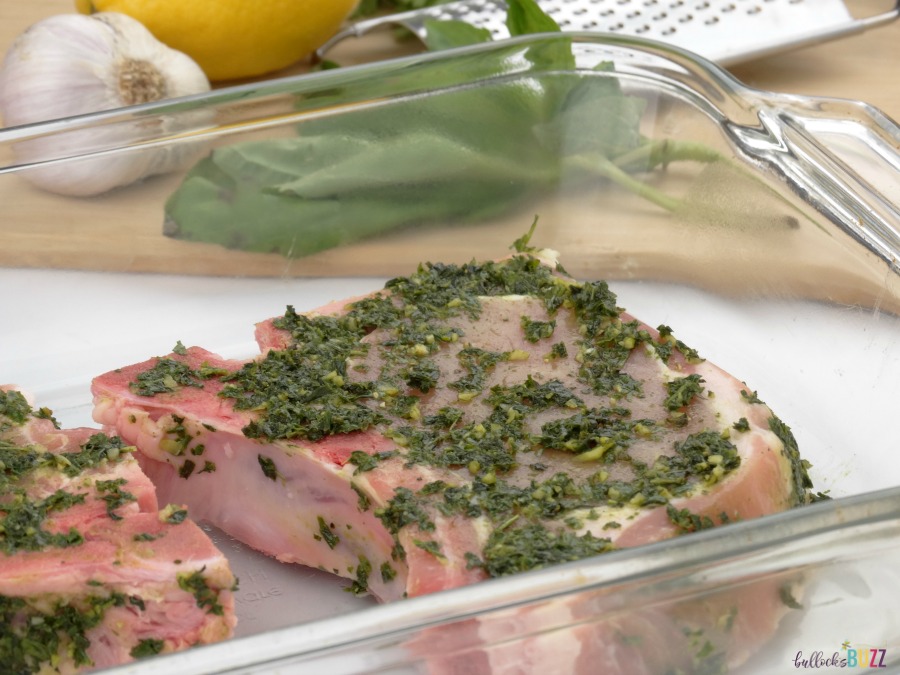 season pork chops on all sides with herbs to make sous vide garlic-basil rubbed pork chops