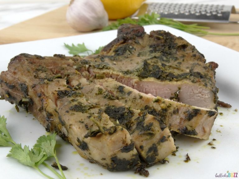 sous vide garlic basil rubber pork chops on a white plate