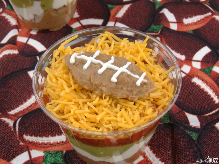 pipe on sour cream laces to the refried bean football