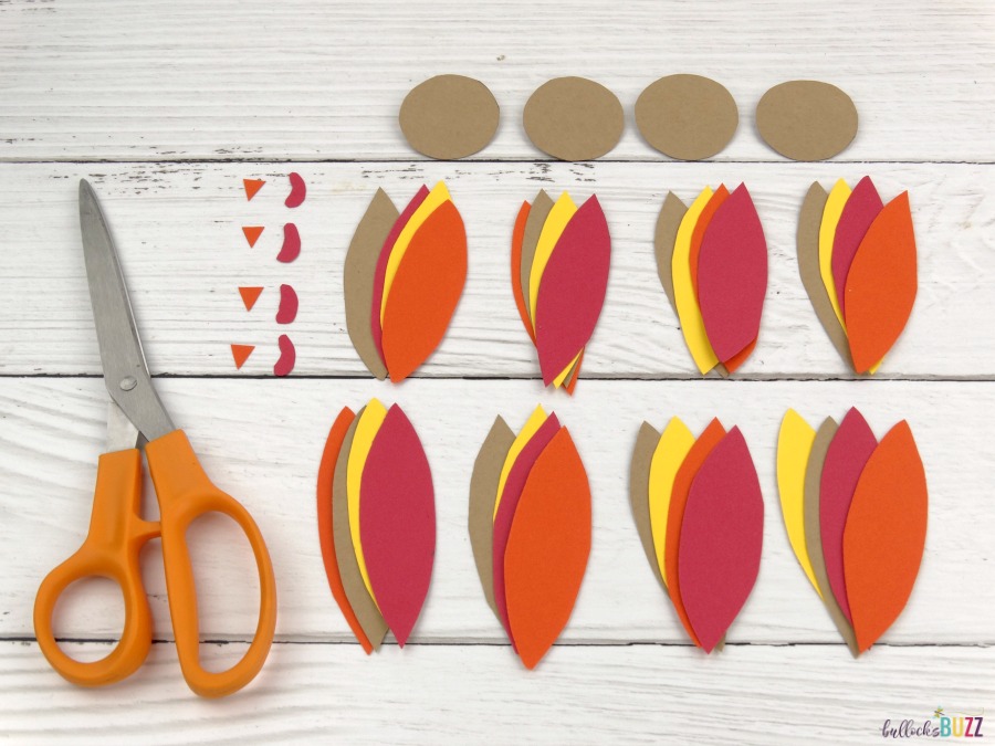 cut out feathers, heads, beaks, and snoods for jello pack thanksgiving turkey treats
